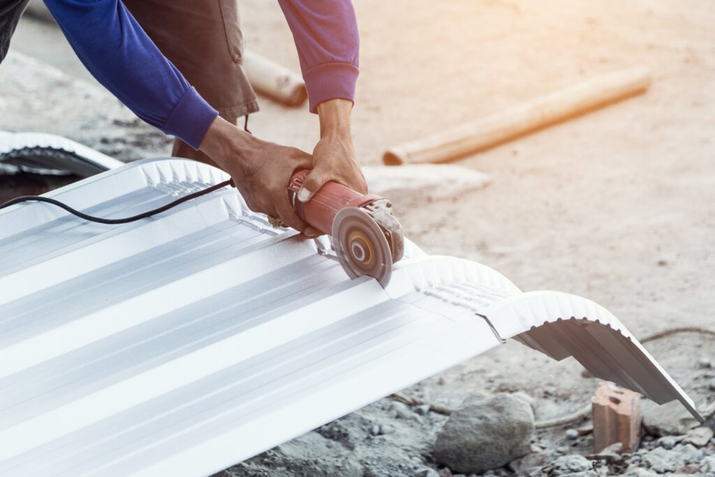 construction-worker-cutting-roof-building-min